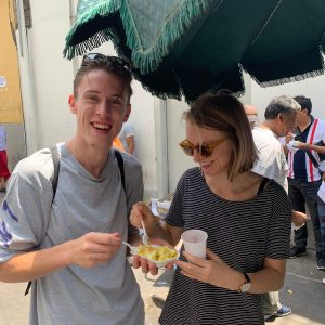 tourists eating papita con huevo